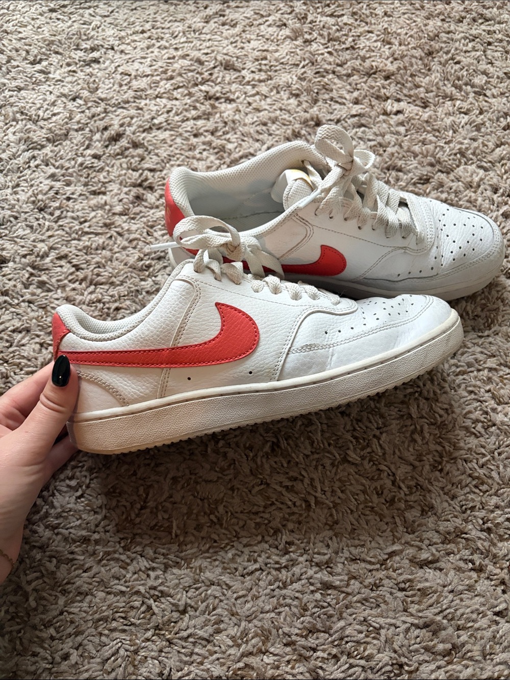 White Nikes with coral color check